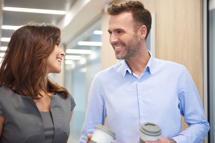Two professionals enjoying coffee together in Canton, Michigan
