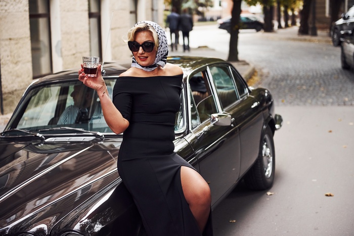 single blonde woman with sunglasses