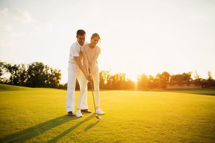 Couple played golf in the Strangerville neighborhood.