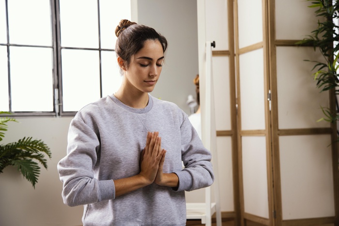 Woman practicing yoga, mindful dating vibes