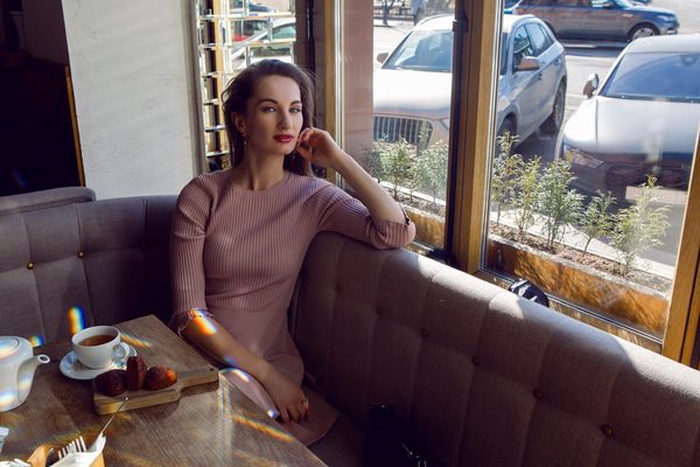 Elegant affluent woman by a Nassau Street café window
