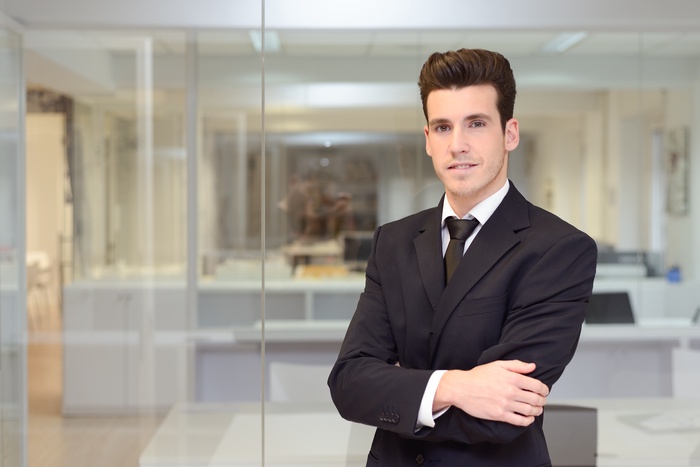 smiling worker with tie suit