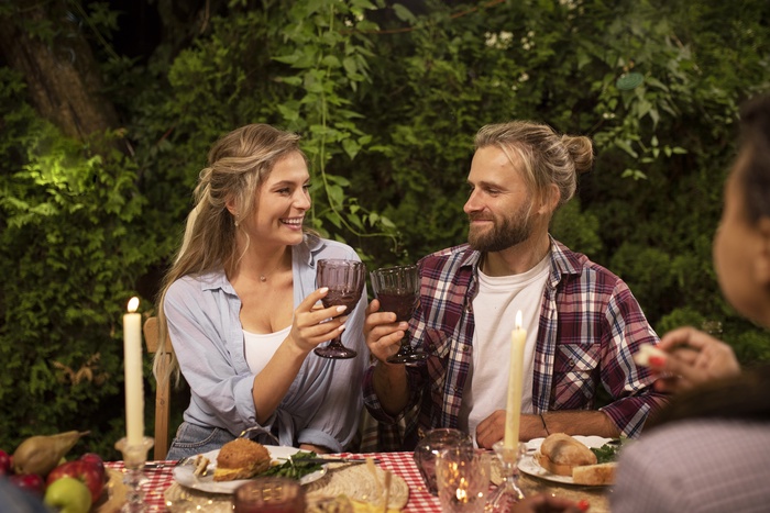 Rich couple dining with champagne in Central Coast