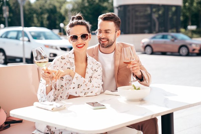 Affluent couple enjoying coffee in an Uptown Waterloo café