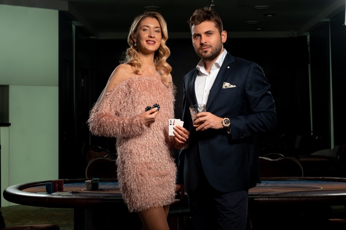 successful girl man winning poker game standing near gaming table casino