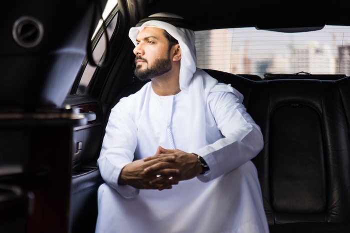 arab businessman sitting in car