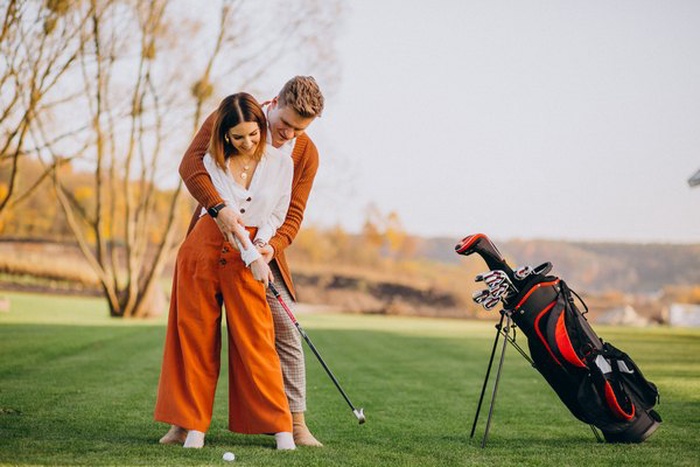 couple playing golf together