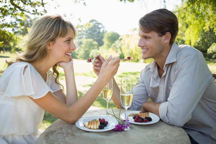Rich men dating enjoying dessert in Bologna, Italy