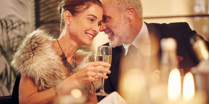 Wealthy man and woman on a romantic dinner date