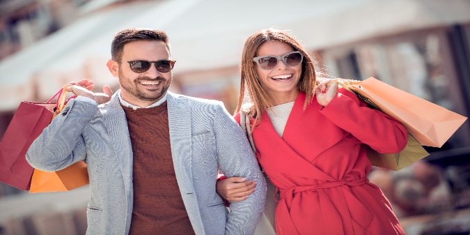 happy couple with shopping bags