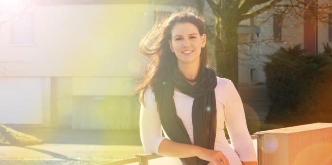 Smiling woman enjoying selective dating outdoors