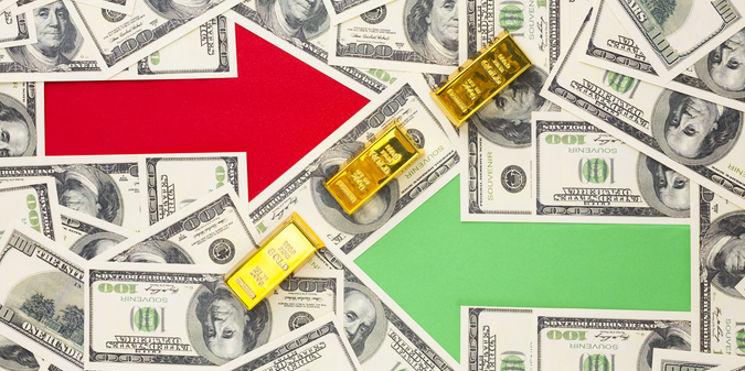 Two arrows on top of banknotes background