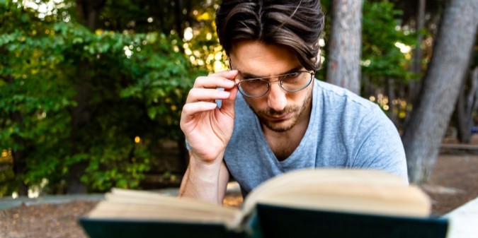 Wise man reading a book