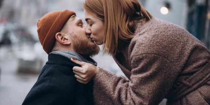 adult loving couple kissing on the street, love