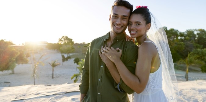 Bride in luxury makeup smiling at sunset