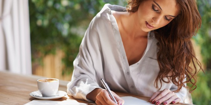 woman writing in a relaxed environment