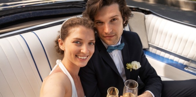 Couple smiling with drinks, online dating success