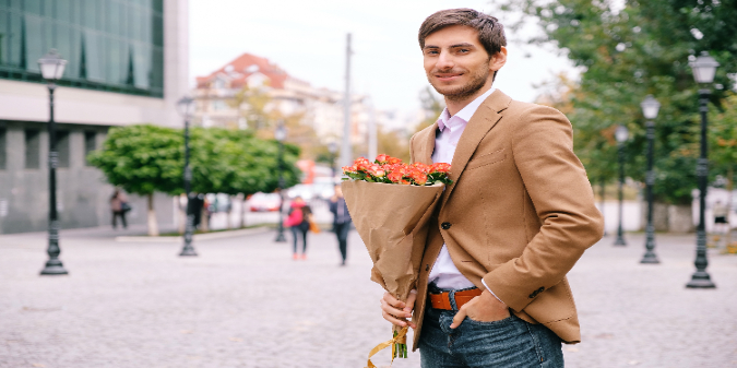 rich guy holding a bouquet of flowers