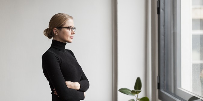 woman looking on window
