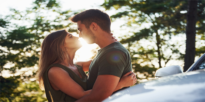 couple beside car
